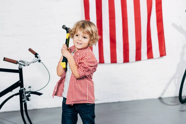 Cheerful Curly Boy Holding Hammer Disassembled Bicycle — Free Stock Photo