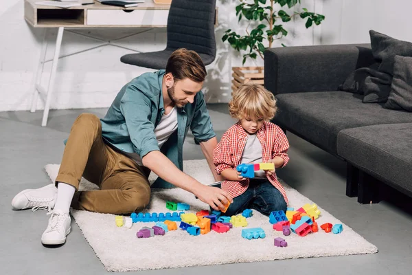 Selective Focus Child His Father Playing Colorful Plastic Blocks Floor — Stock Photo, Image