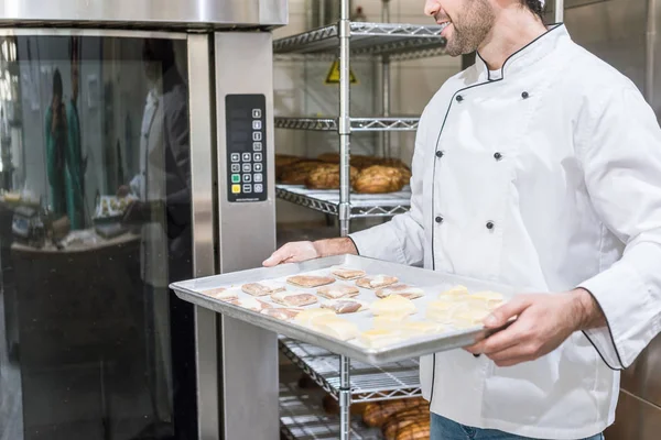Cropped View Male Cook Holding Baking Tray Raw Dough Oven — Stock Photo, Image