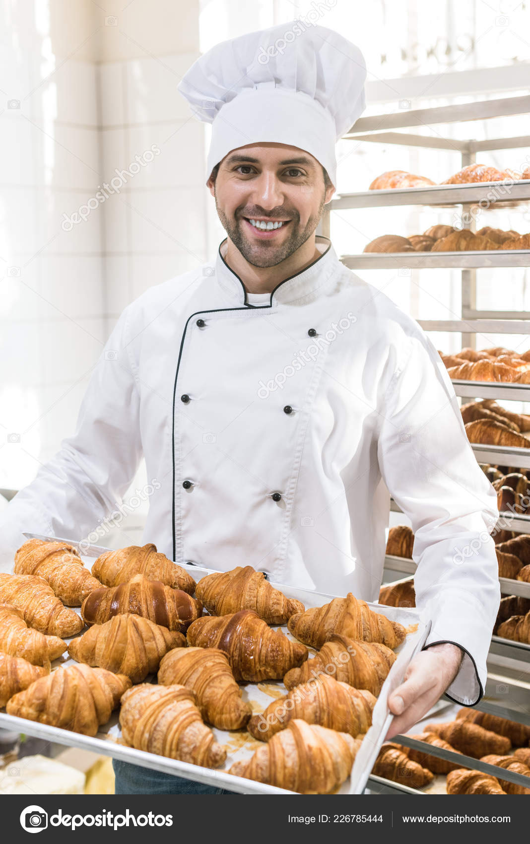 Smiling Baker White Chefs Uniform Tray Full Fresh Croissants Stock