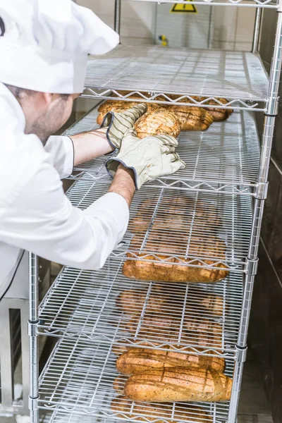 Male Chef Taking Out Fresh Bread Gloves — Stock Photo, Image