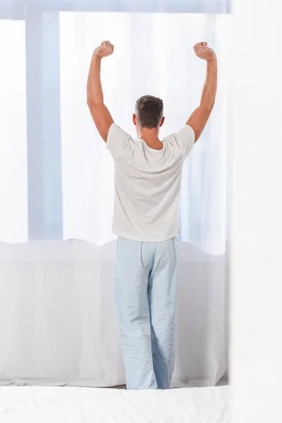 Back View Man Stretching Room — Stock Photo, Image