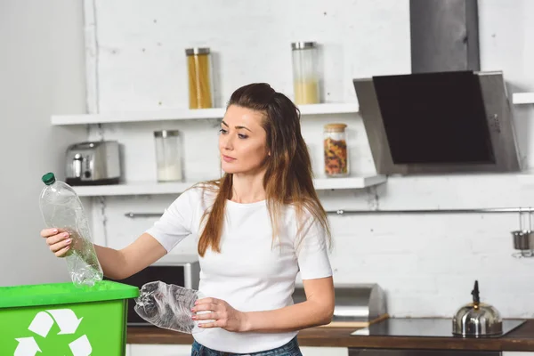 Woman Putting Plastic Bottles Green Recycle Box Wooden Table Kitchen — Free Stock Photo