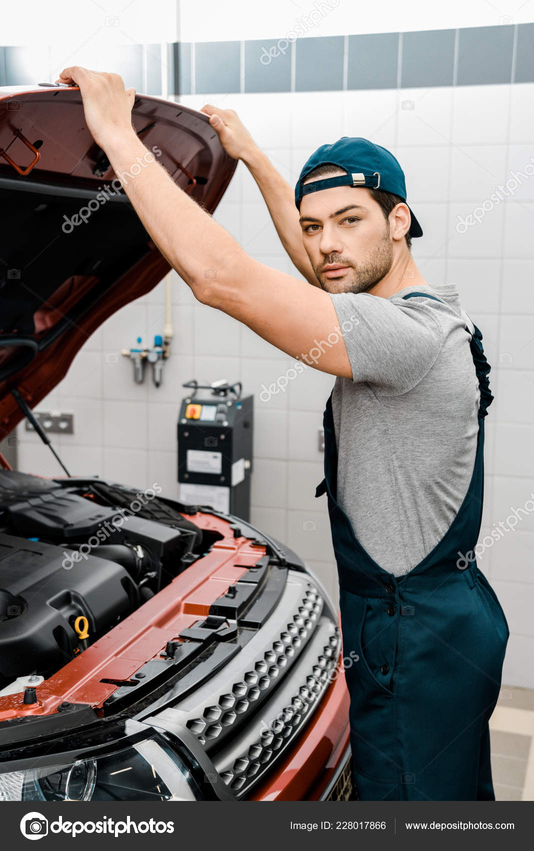 Auto Mechanic Looking Camera While Examining Car Cowl — Stock