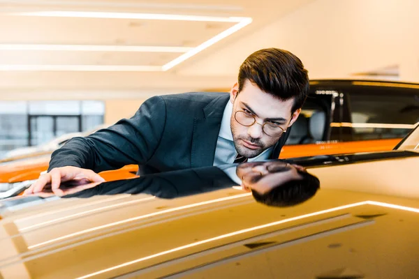 Concentrated Businessman Eyeglasses Choosing Automobile Dealership Salon — Stock Photo, Image
