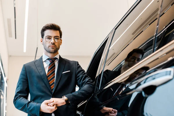 Low Angle View Businessman Eyeglasses Posing Automobile Car Salon — Stock Photo, Image