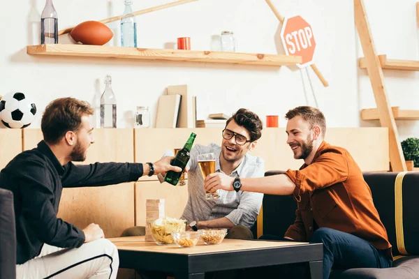Cheerful Friends Clinking Drinks While Resting Cafe Together — Free Stock Photo