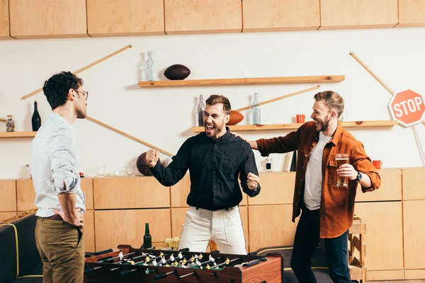 Man Looking Young Friends Playing Table Soccer Cafe — Stock Photo, Image