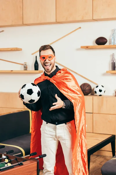 Excited Young Man Red Superhero Costume Soccer Ball Cafe — Stock Photo, Image