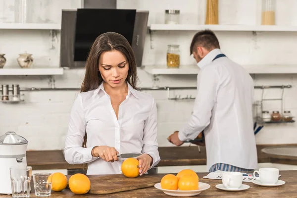boyfriend and girlfriend preparing breakfast on weekday, gender equality concept