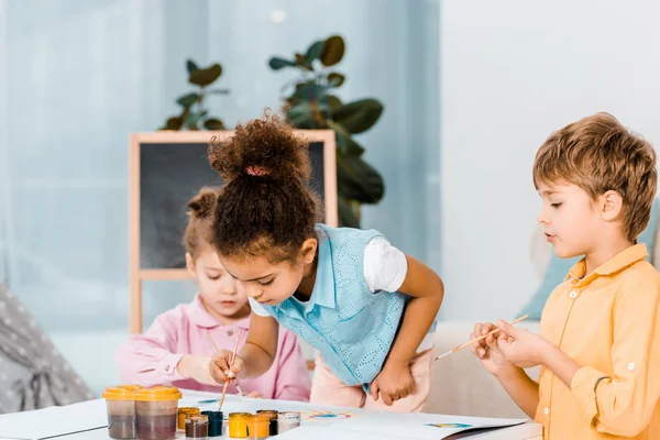 Beautiful Little Multiracial Children Painting Together — Stock Photo, Image