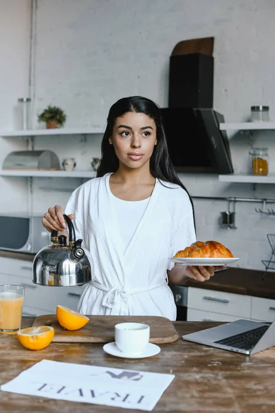 Beautiful Mixed Race Girl White Robe Holding Kettle Plate Croissants — Free Stock Photo