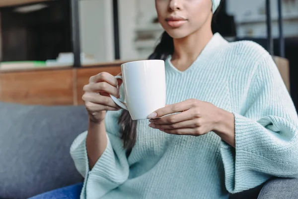 Cropped Image Mixed Race Girl Turquoise Sweater Headband Sitting Sofa — Free Stock Photo