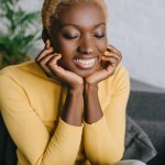 Selective focus of attractive african american woman with short hair