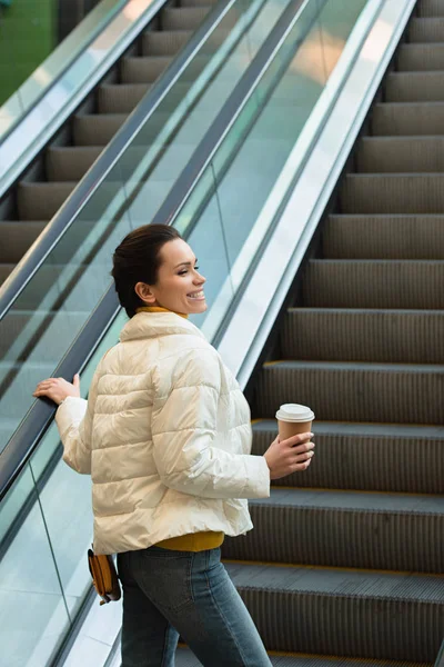 Beautiful Girl Smiling Going Escalator Holding Paper Cup — Free Stock Photo