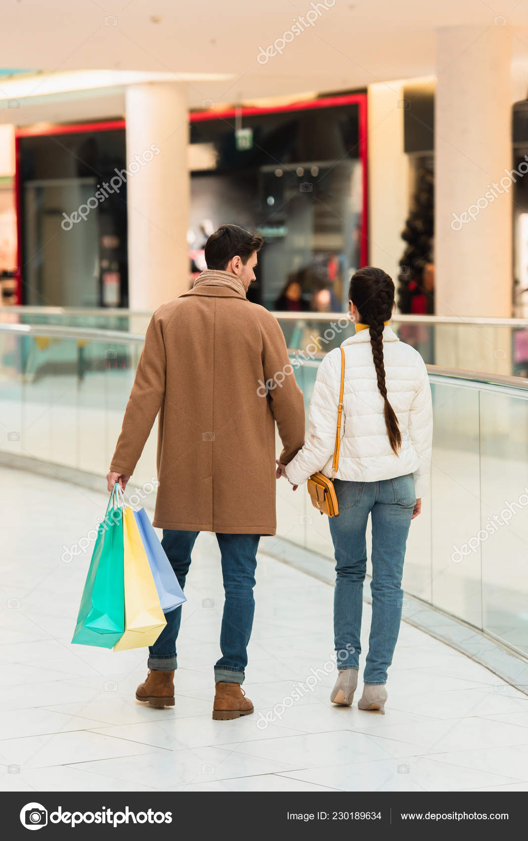 Woman Holding Many Shopping Bags In Shopping Mall Stock Photo, Picture and  Royalty Free Image. Image 58286343.