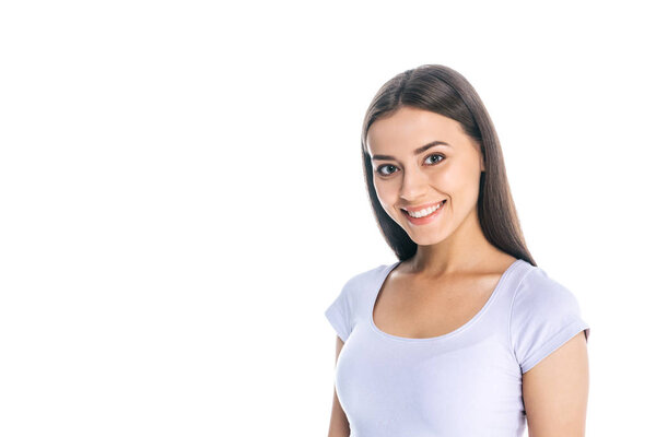 portrait of smiling pretty woman looking at camera isolated on white