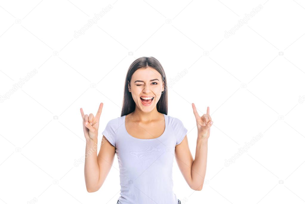 portrait of smiling attractive woman showing rock sign isolated on white