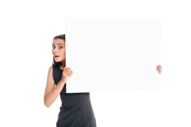 portrait of shocked young woman holding blank banner isolated on white clipart