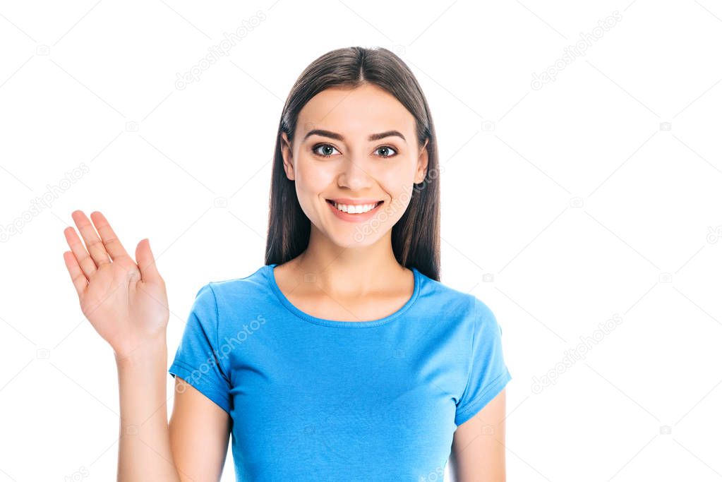 portrait of attractive positive woman waving to camera isolated on white