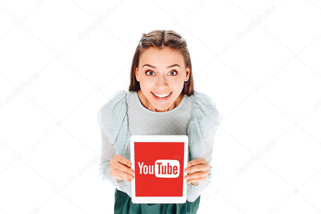 High angle view of smiling woman with tablet with youtube logo on screen isolated on white