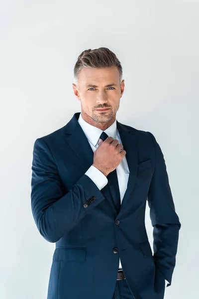 Handsome Businessman Fixing Tie Looking Camera Isolated White — Stock Photo, Image