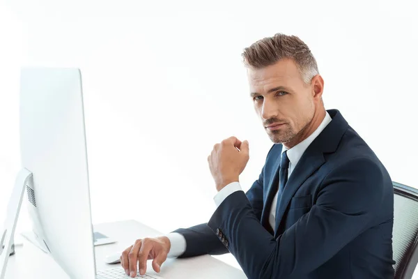 Handsome Businessman Sitting Table Computer Looking Camera Isolated White — Stock Photo, Image