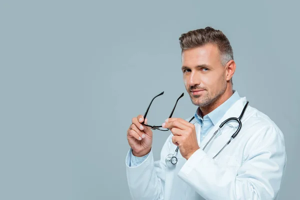 Handsome Doctor Stethoscope Holding Glasses Looking Camera Isolated White — Free Stock Photo