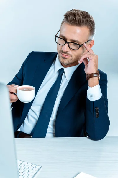 Handsome Businessman Holding Cup Coffee Looking Computer Isolated White — Stock Photo, Image