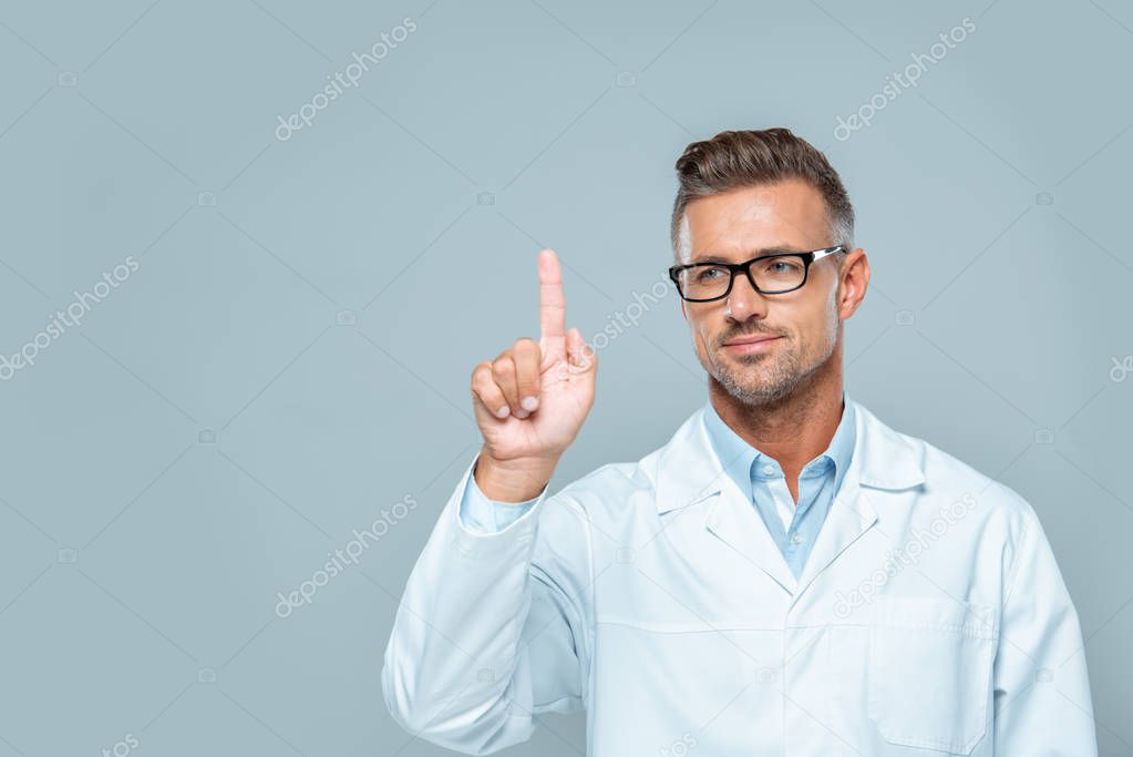 Handsome scientist in white coat and glasses touching something in air isolated on white, artificial intelligence concept