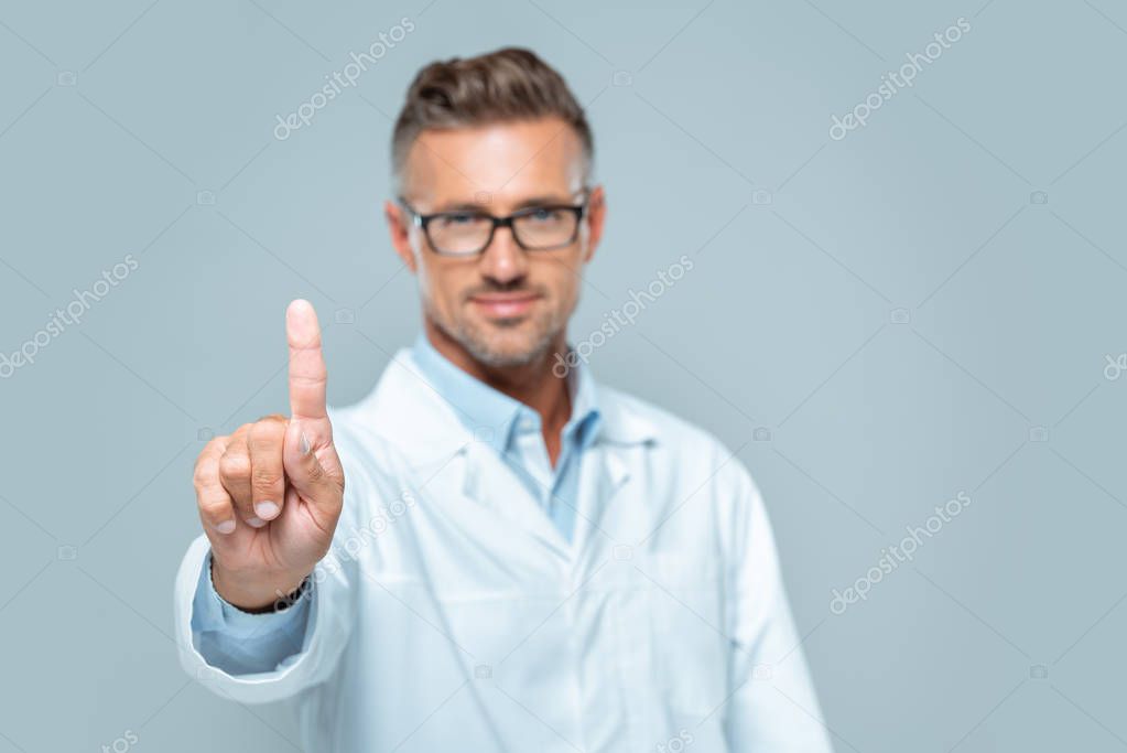 Selective focus of handsome scientist touching something in air isolated on white, artificial intelligence concept