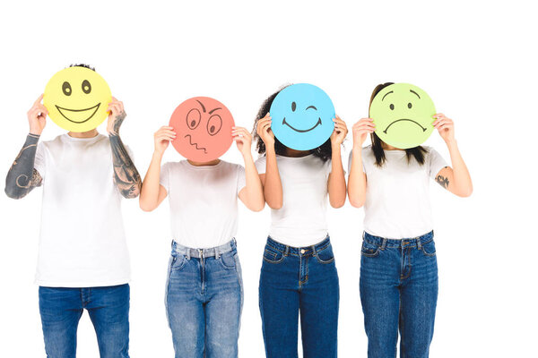 multicultural friends in white T-shirts holding round, multicolored signs with different face expressions isolated on white