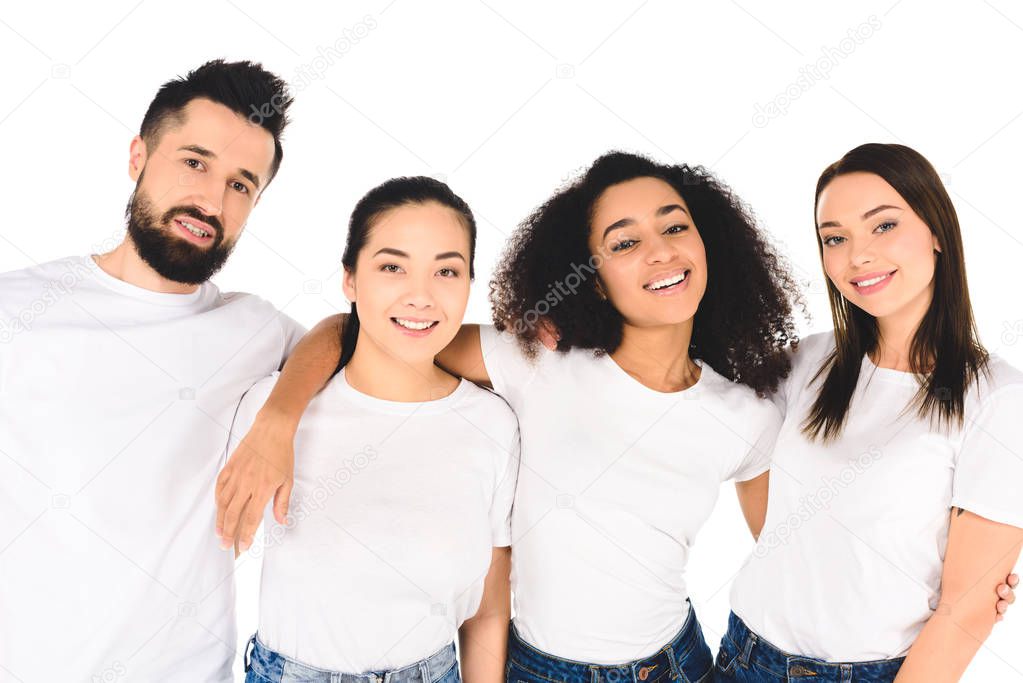 multicultural group of friends hugging and looking at camera isolated on white