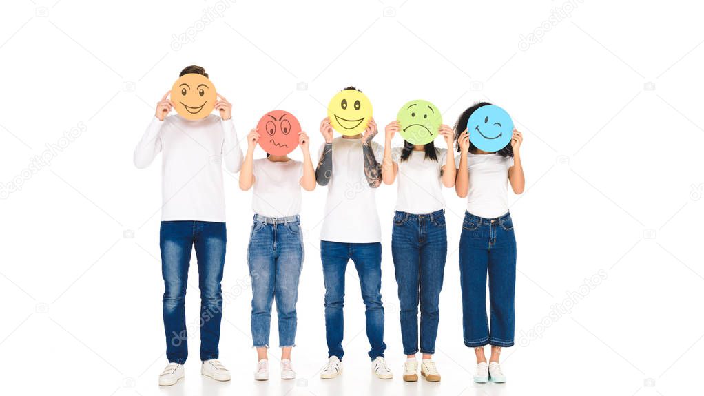 multicultural friends in white T-shirts with different multicolored signs looking at camera isolated on white 