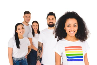 multiethnic group of young people standing behind african american woman with lgbt sign on t-shirt  isolated on white clipart