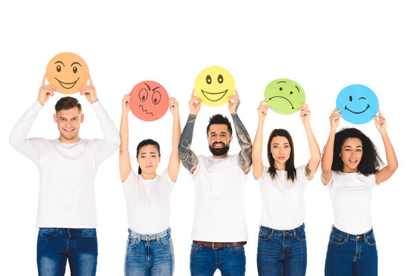 multicultural friends in denim raising cards with emotions above head isolated on white