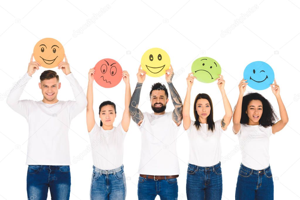 multicultural friends in denim raising cards with emotions above head isolated on white