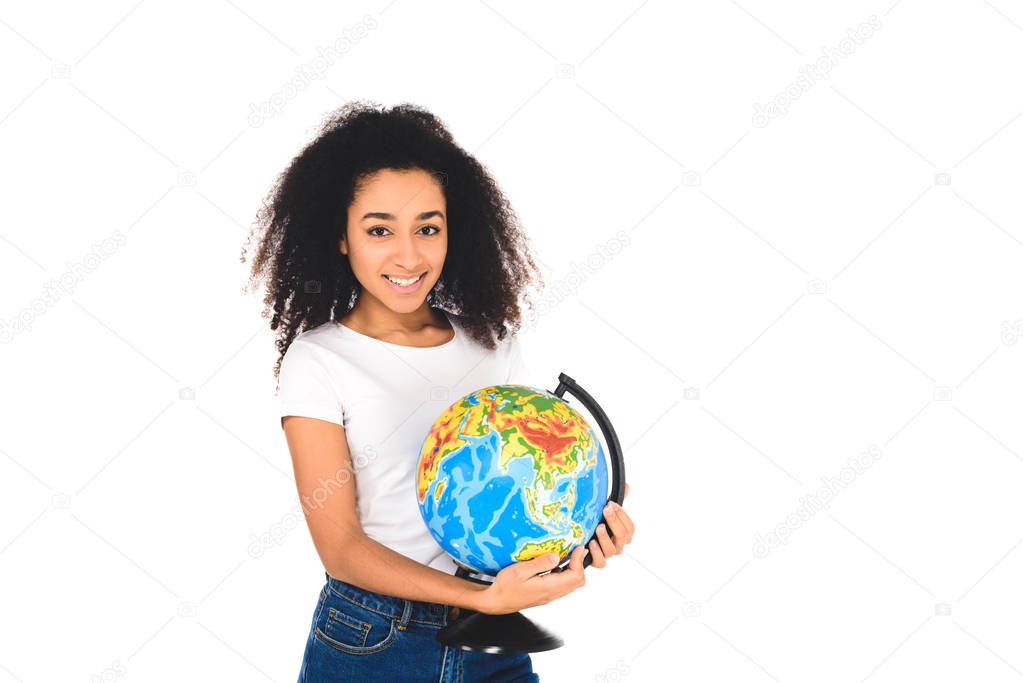 cheerful curly african american girl holding globe isolated on white