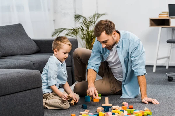 Handsome Man Cute Boy Playing Multicolored Wooden Blocks Floor Apartment — Stock Photo, Image