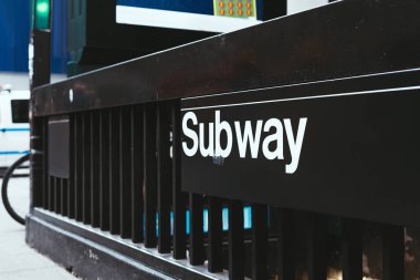 close up view of subway sign on street in new york, usa clipart