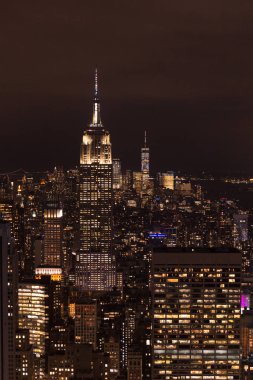 aerial view of buildings and night city lights in new york, usa clipart