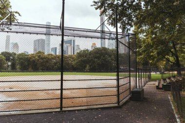 scenic view of playground and buildings on background, new york, usa clipart