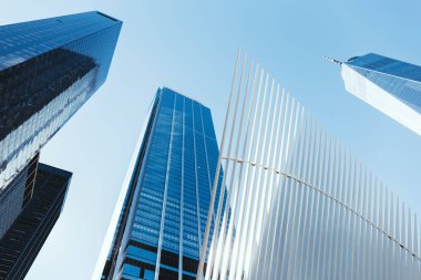 low angle view of skyscrapers and clear sky in new york city, usa clipart