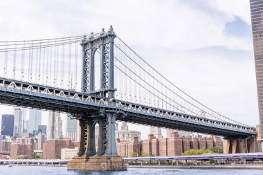 urban scene with brooklyn bridge and manhattan in new york, usa clipart