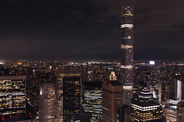 aerial view of buildings and night city lights in new york, usa