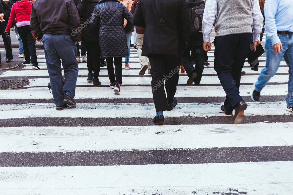 partial view of people crossing road in new york, usa