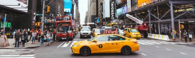 NEW YORK, USA - OCTOBER 8, 2018: panoramic view of yellow cabs and people in new york city, usa clipart