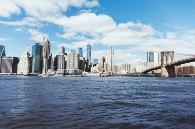 MANHATTAN, NEW YORK, USA - OCTOBER 8, 2018: beautiful view of cloudy sky, manhattan and brooklyn bridge in new york, usa clipart