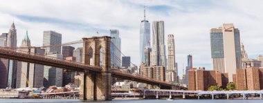 MANHATTAN, NEW YORK, USA - OCTOBER 8, 2018: panoramic view of manhattan and brooklyn bridge in new york, usa clipart