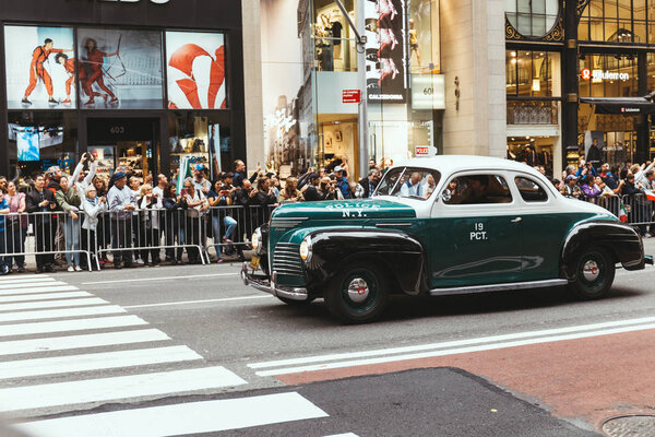 NEW YORK, USA - OCTOBER 8, 2018: city parade with retro car on street in new york, usa